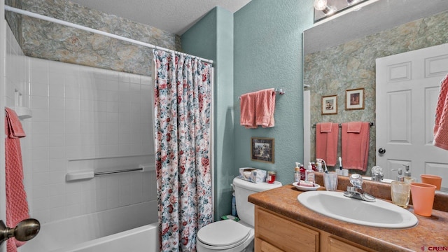 2384 Ridge Circle Dr Unit 14, Grand Junction, CO 81507 - full bathroom with toilet, vanity, shower / bath combination with curtain, a textured wall, and a textured ceiling