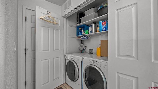 2384 Ridge Circle Dr Unit 14, Grand Junction, CO 81507 - laundry area featuring independent washer and dryer and light tile patterned floors