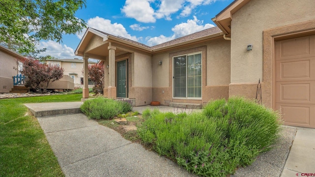 2384 Ridge Circle Dr Unit 14, Grand Junction, CO 81507 - view of exterior entry with stucco siding