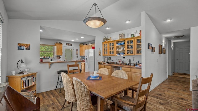 2384 Ridge Circle Dr Unit 14, Grand Junction, CO 81507 - dining room with lofted ceiling, dark wood-style flooring, recessed lighting, and baseboards