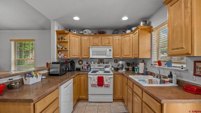 2384 Ridge Circle Dr Unit 14, Grand Junction, CO 81507 - kitchen with white appliances, a sink, a peninsula, light tile patterned floors, and open shelves