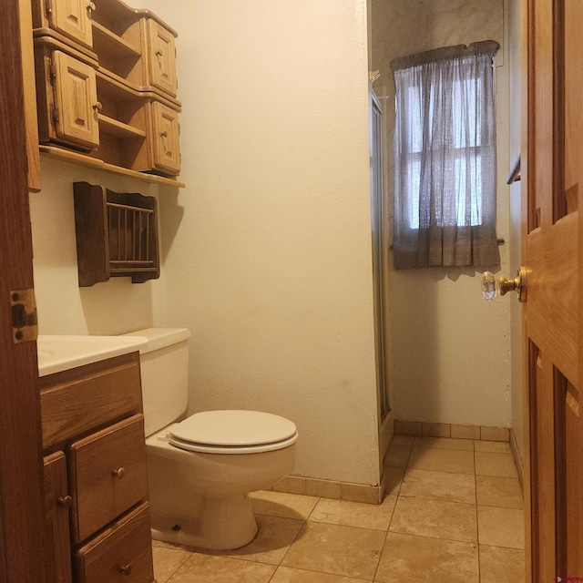 1016 Ln 12 N, Hooper, CO 81136 - full bathroom featuring toilet, a stall shower, tile patterned floors, and vanity