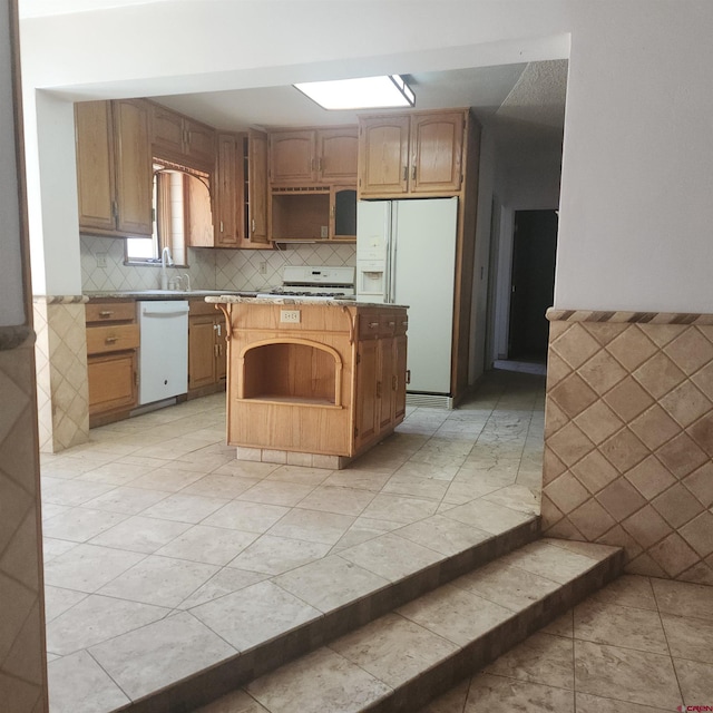 1016 Ln 12 N, Hooper, CO 81136 - kitchen featuring white appliances, open shelves, a center island, tasteful backsplash, and light countertops