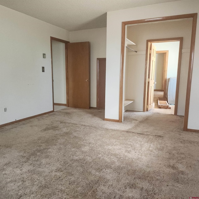 1016 Ln 12 N, Hooper, CO 81136 - unfurnished bedroom with carpet flooring, baseboards, and a closet