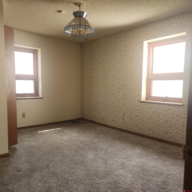1016 Ln 12 N, Hooper, CO 81136 - carpeted spare room featuring a textured ceiling and baseboards