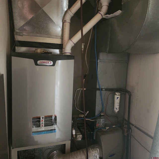 1016 Ln 12 N, Hooper, CO 81136 - utility room featuring heating unit