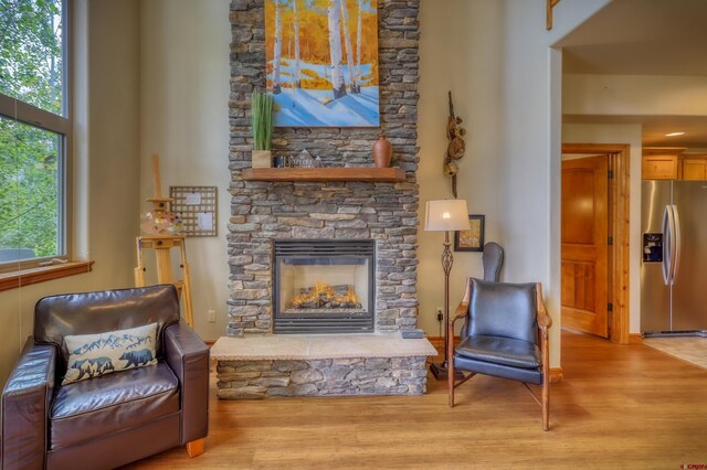135 Eaton Dr Unit 1012, Pagosa Springs, CO 81147 - sitting room with wood finished floors and a stone fireplace
