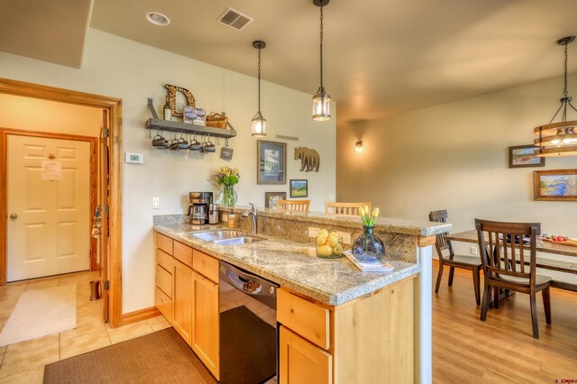135 Eaton Dr Unit 1012, Pagosa Springs, CO 81147 - kitchen featuring dishwasher, a peninsula, a sink, and pendant lighting
