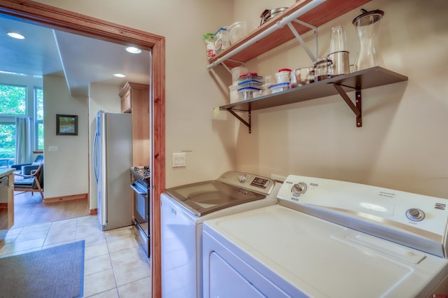 135 Eaton Dr Unit 1012, Pagosa Springs, CO 81147 - laundry room featuring light tile patterned flooring, washing machine and clothes dryer, and recessed lighting