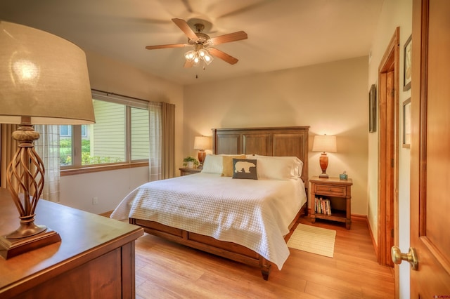 135 Eaton Dr Unit 1012, Pagosa Springs, CO 81147 - bedroom featuring light wood-style flooring, baseboards, and a ceiling fan