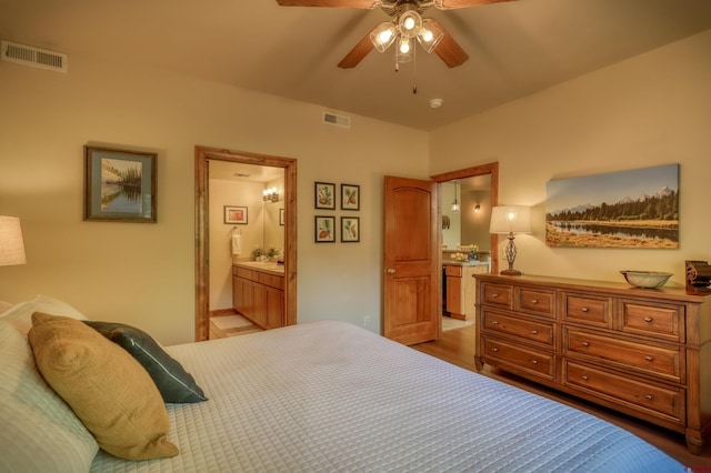 135 Eaton Dr Unit 1012, Pagosa Springs, CO 81147 - bedroom featuring ensuite bathroom, ceiling fan, and wood finished floors