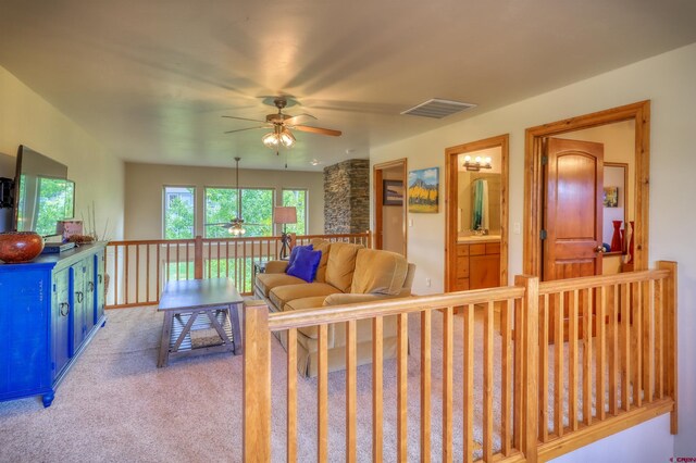 135 Eaton Dr Unit 1012, Pagosa Springs, CO 81147 - living room featuring a ceiling fan and carpet flooring