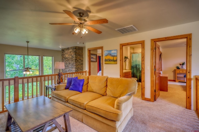 135 Eaton Dr Unit 1012, Pagosa Springs, CO 81147 - living room with ceiling fan, light carpet, and baseboards