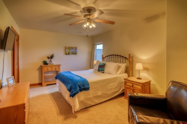 135 Eaton Dr Unit 1012, Pagosa Springs, CO 81147 - bedroom with light carpet and a ceiling fan