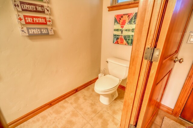 135 Eaton Dr Unit 1012, Pagosa Springs, CO 81147 - bathroom with toilet, baseboards, and tile patterned floors