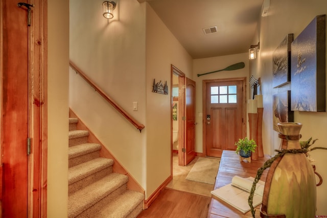 135 Eaton Dr Unit 1012, Pagosa Springs, CO 81147 - entrance foyer featuring stairway, light wood-style floors, and baseboards