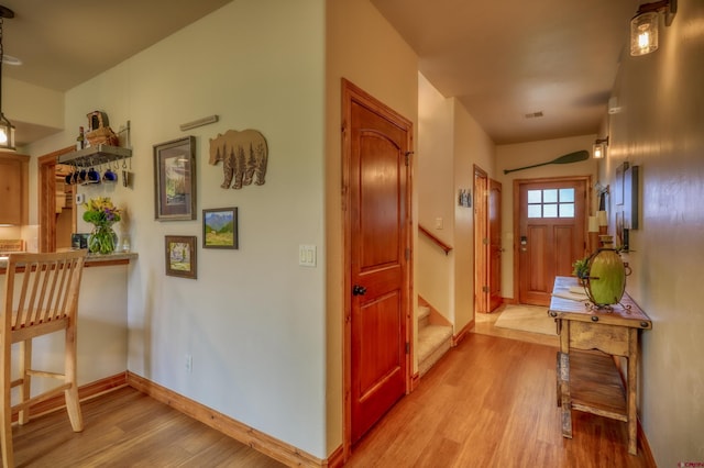 135 Eaton Dr Unit 1012, Pagosa Springs, CO 81147 - entrance foyer featuring light wood-style floors, stairs, and baseboards