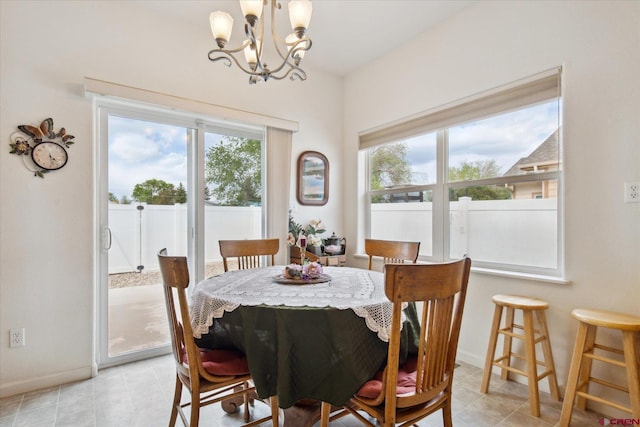 502 S Juniper Pl, Cortez, CO 81321 - dining area featuring a chandelier, baseboards, and light tile patterned floors
