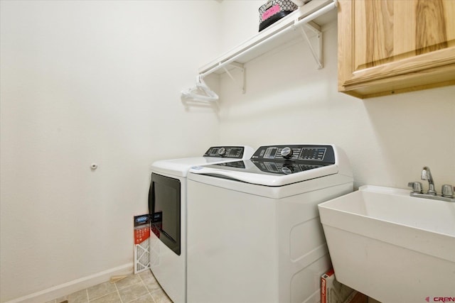 502 S Juniper Pl, Cortez, CO 81321 - laundry area with cabinet space, washer and clothes dryer, and baseboards