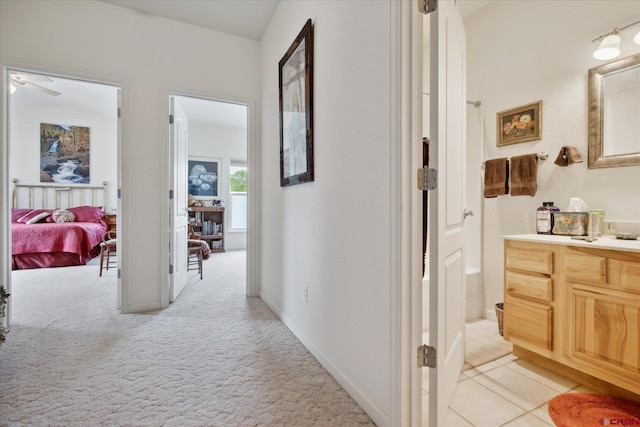 502 S Juniper Pl, Cortez, CO 81321 - hallway featuring light carpet and baseboards