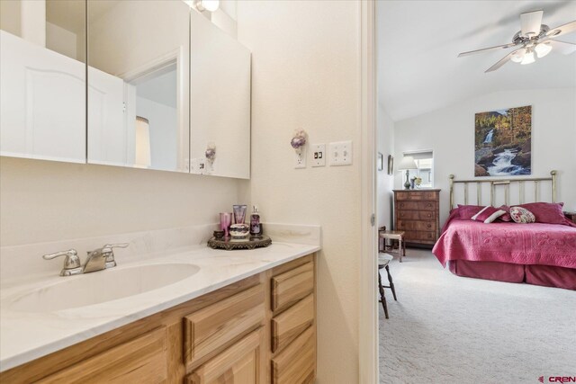 502 S Juniper Pl, Cortez, CO 81321 - ensuite bathroom with vaulted ceiling, a ceiling fan, and vanity