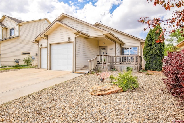 502 S Juniper Pl, Cortez, CO 81321 - view of front of home with a garage and concrete driveway