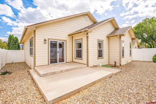 502 S Juniper Pl, Cortez, CO 81321 - rear view of property featuring a fenced backyard and a patio
