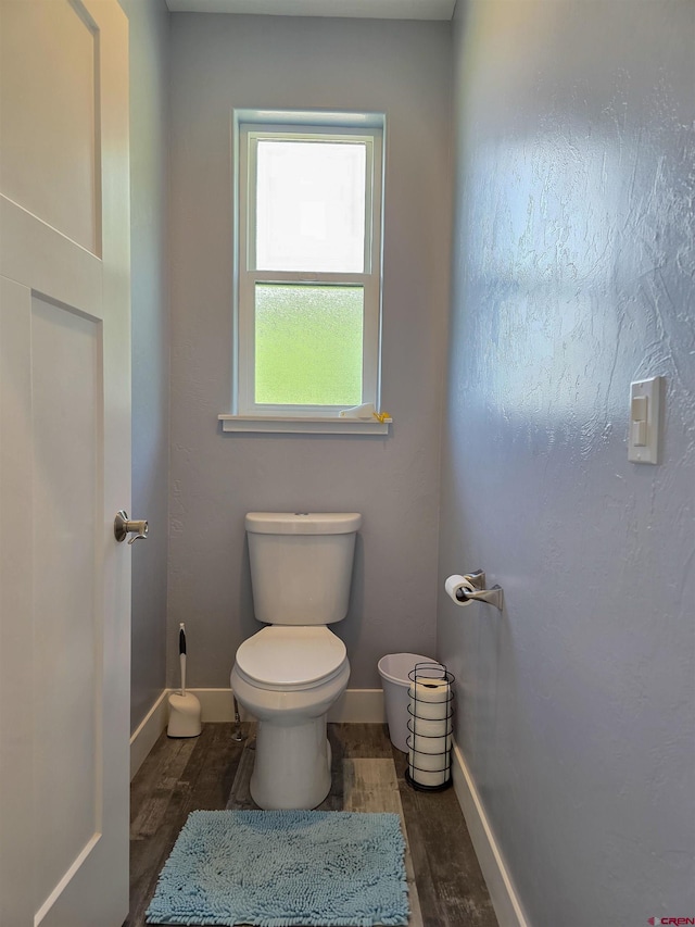 1771 Trappers Ct, Delta, CO 81416 - bathroom with toilet, wood finished floors, and baseboards