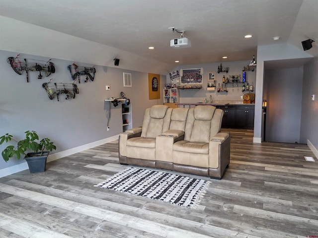 1771 Trappers Ct, Delta, CO 81416 - home theater room with wet bar, wood finished floors, baseboards, recessed lighting, and lofted ceiling