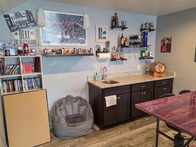 1771 Trappers Ct, Delta, CO 81416 - indoor wet bar with light wood-style floors