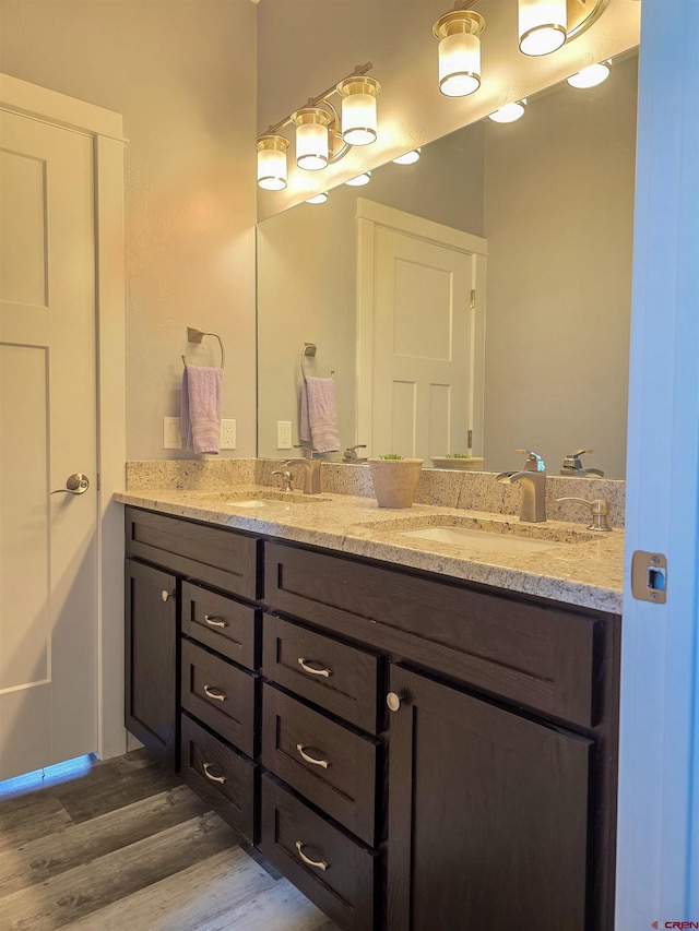 1771 Trappers Ct, Delta, CO 81416 - full bathroom featuring wood finished floors and double vanity
