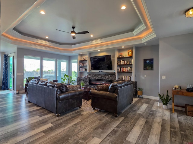 1771 Trappers Ct, Delta, CO 81416 - living area with a raised ceiling, ornamental molding, ceiling fan, dark wood-style floors, and a fireplace