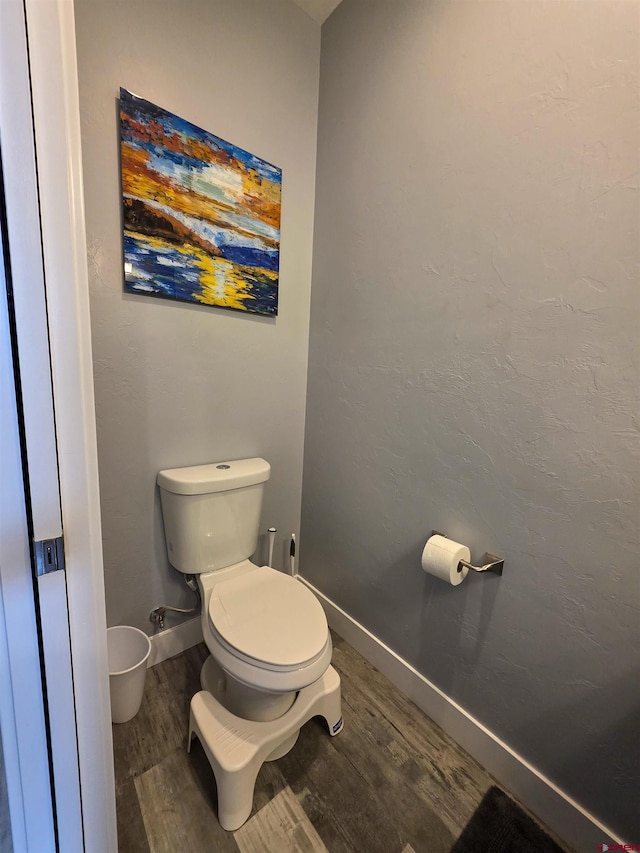 1771 Trappers Ct, Delta, CO 81416 - bathroom with wood finished floors, toilet, and baseboards