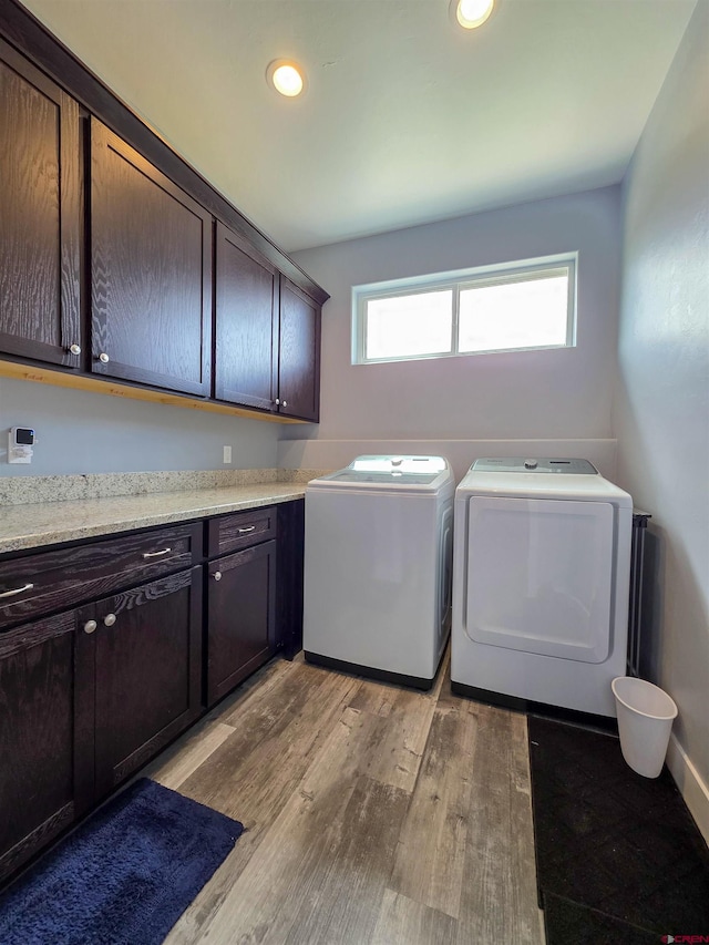 1771 Trappers Ct, Delta, CO 81416 - laundry area featuring cabinet space, washer and dryer, light wood-type flooring, recessed lighting, and baseboards