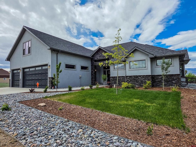 1771 Trappers Ct, Delta, CO 81416 - view of front of house featuring stone siding, stucco siding, a front lawn, and concrete driveway