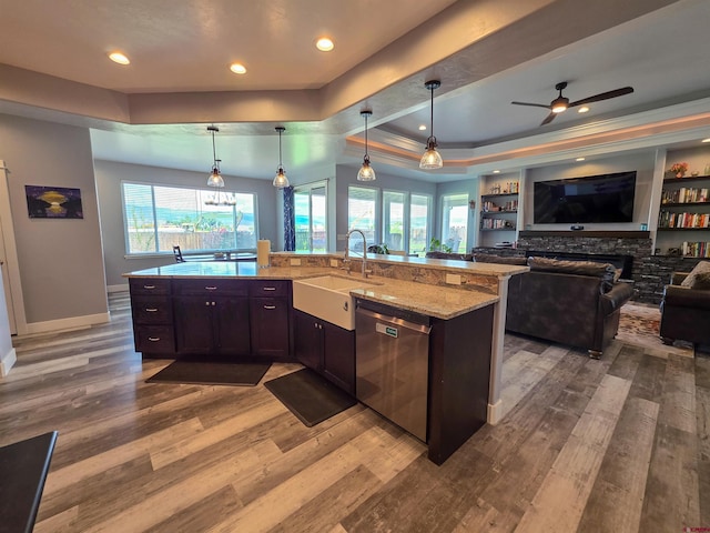 1771 Trappers Ct, Delta, CO 81416 - kitchen featuring stainless steel dishwasher, a sink, open floor plan, light wood-style flooring, and recessed lighting