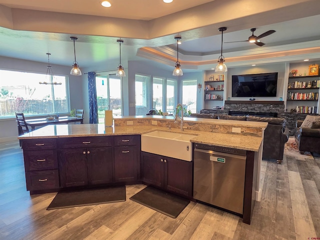 1771 Trappers Ct, Delta, CO 81416 - kitchen featuring dishwasher, open floor plan, a sink, a raised ceiling, and ornamental molding