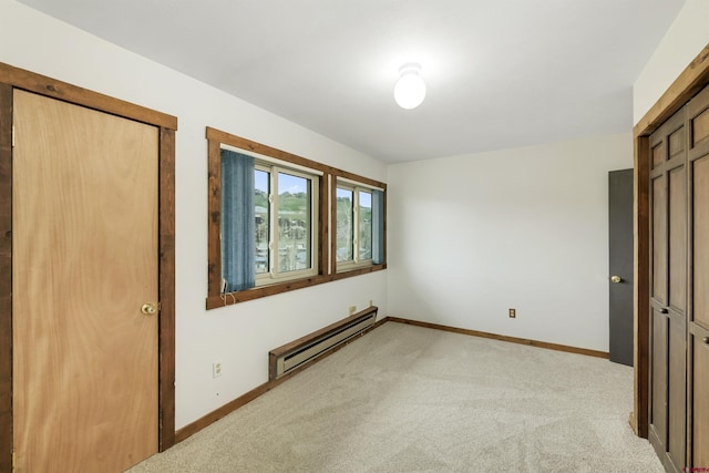 22 Castle Rd Unit 2, Mount Crested Butte, CO 81225 - unfurnished bedroom with a baseboard radiator, light carpet, and baseboards
