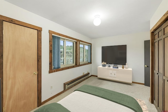 22 Castle Rd Unit 2, Mount Crested Butte, CO 81225 - bedroom featuring baseboard heating, light carpet, and baseboards