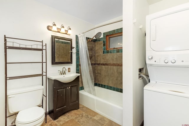 22 Castle Rd Unit 2, Mount Crested Butte, CO 81225 - full bath featuring stacked washing machine and dryer, stone finish flooring, toilet, shower / tub combo with curtain, and vanity