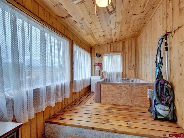 sunroom featuring lofted ceiling
