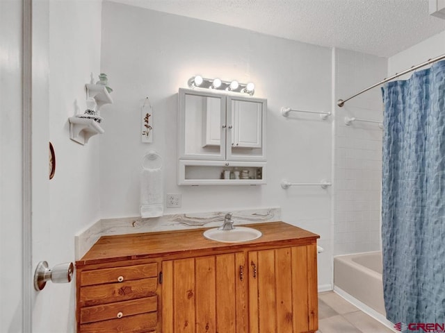 full bath with a textured ceiling, shower / bathtub combination with curtain, and vanity
