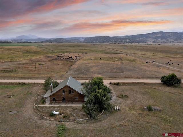aerial view at dusk of a view of countryside and a mountain view