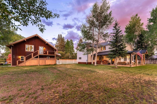 414 N Spruce St, Gunnison, CO 81230 - back of property at dusk with stairway and a patio