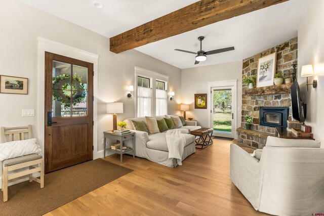 414 N Spruce St, Gunnison, CO 81230 - living room featuring light wood finished floors, beamed ceiling, and ceiling fan