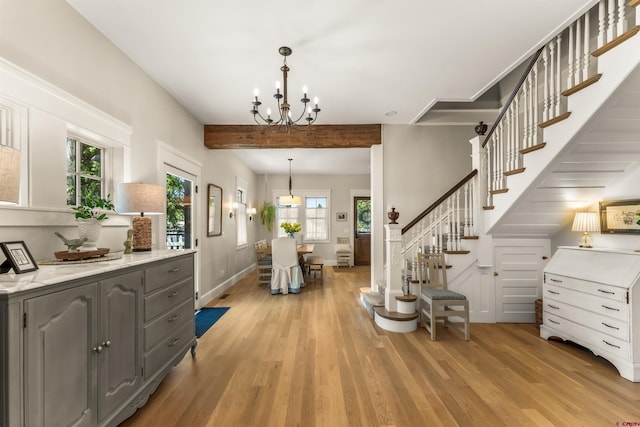 414 N Spruce St, Gunnison, CO 81230 - foyer entrance featuring light wood-style floors, beamed ceiling, a chandelier, stairway, and baseboards