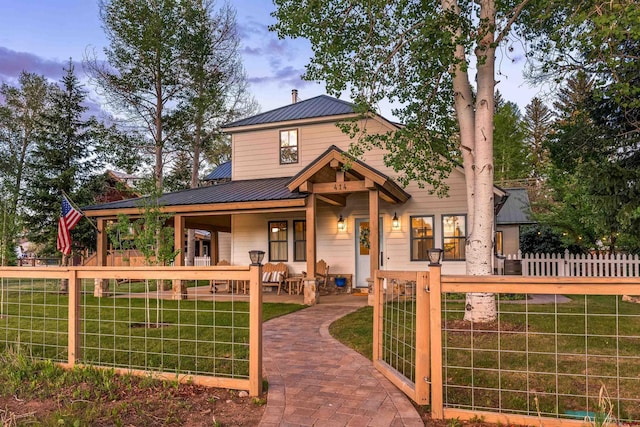 414 N Spruce St, Gunnison, CO 81230 - view of front facade featuring a porch, a gate, and metal roof
