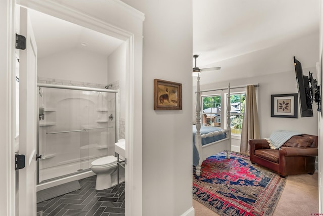 414 N Spruce St, Gunnison, CO 81230 - ensuite bathroom with a shower stall, ceiling fan, toilet, and vaulted ceiling