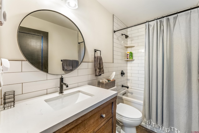 414 N Spruce St, Gunnison, CO 81230 - bathroom with tile walls, backsplash, shower / tub combo with curtain, toilet, and vanity