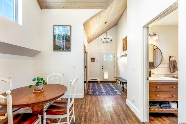 414 N Spruce St, Gunnison, CO 81230 - entrance foyer with dark wood-style floors, wooden ceiling, a chandelier, baseboards, and high vaulted ceiling